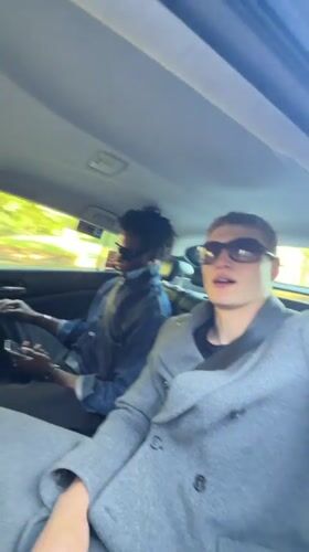 Two young men observed in car backseat in London