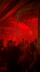 Red-lit nightclub scene captured in Moscow evening hours