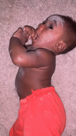 Baby with white powder observed on rug in Nigeria