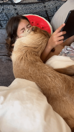 Woman recovers in bed with dog companion in Salou