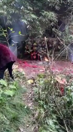 Woman documents firecracker ceremony with selfies in rural Chongqing