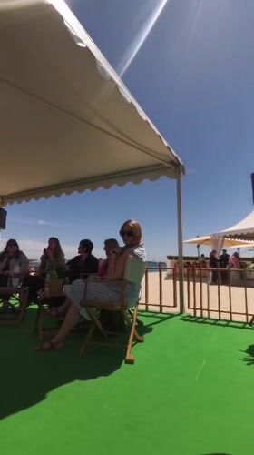Small gathering observed under canopy in Cannes