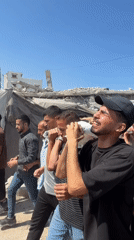 Funeral procession through rubble-strewn streets in Gaza