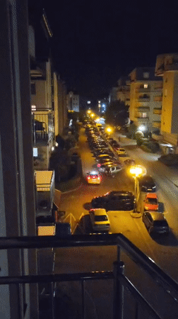Nighttime street observations and cat moments captured from above