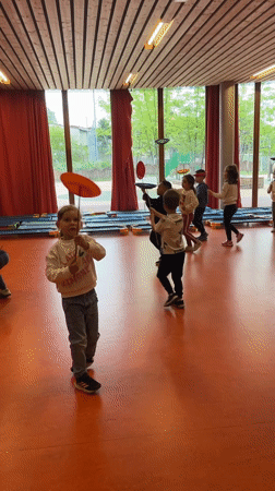 Children practice plate spinning skills in La Fouillouse facility