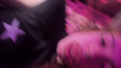 Late-night tattoo session under purple lights in Buenos Aires