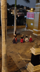 Traditional folk dancers perform in colorful dress at dusk, Barranco