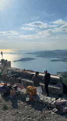 Mountain gathering with DJ setup overlooks Budva bay