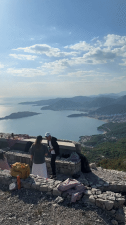 Mountain gathering with DJ setup overlooks Budva bay