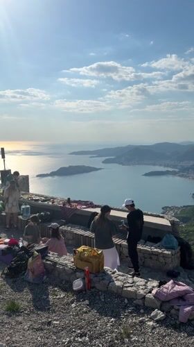 Mountain gathering with DJ setup overlooks Budva bay