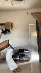 Man performs handstand in room in Bauchi, Nigeria