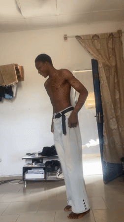Man performs handstand in room in Bauchi, Nigeria