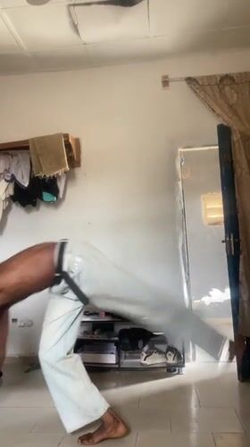 Man performs handstand in room in Bauchi, Nigeria
