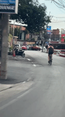Helmet-on cycling through wet Ko Samui streets