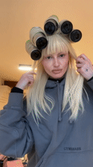London woman uses aluminum cans as hair rollers