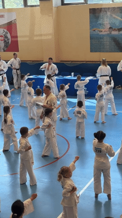 Children practice karate in Yekaterinburg gymnasium session