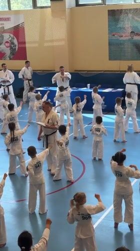 Children practice karate in Yekaterinburg gymnasium session