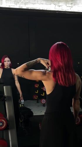 Red-haired woman photographed at Tibubeneng gym early morning