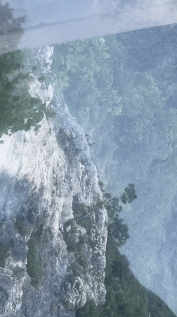 Glass walkway over a steep cliffside in Yongding District