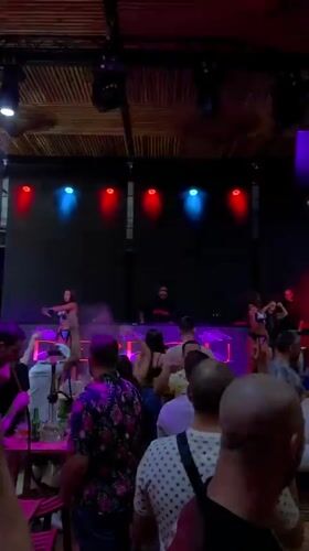 Late-night club set with DJ and dancers in Burgas
