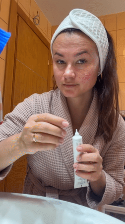 Woman's morning skincare routine documented in Montenegro bathroom