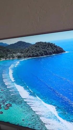 TV broadcasts tropical coastal scenery in Blagoevgrad, Bulgaria