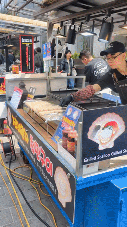 Early morning street food activity observed in Seoul's Myeongdong