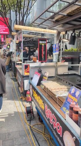 Early morning street food activity observed in Seoul's Myeongdong