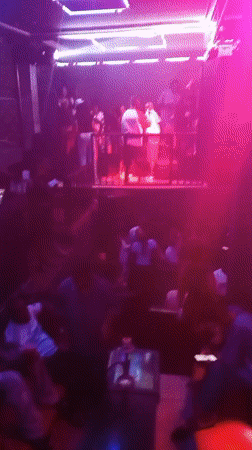 Late-night club session in Lokoja with DJ, live drums, and crowd