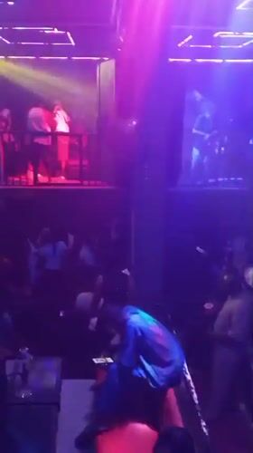 Late-night club session in Lokoja with DJ, live drums, and crowd