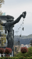 Theater mask statue observed in downtown Tbilisi, Georgia