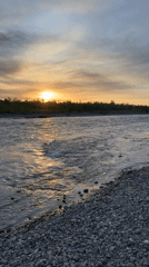 Sunset captured along river in Zarechny, Russia