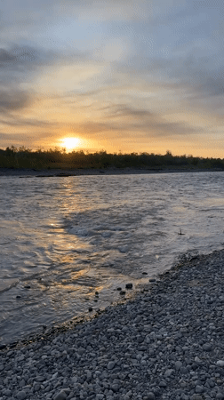 Sunset captured along river in Zarechny, Russia