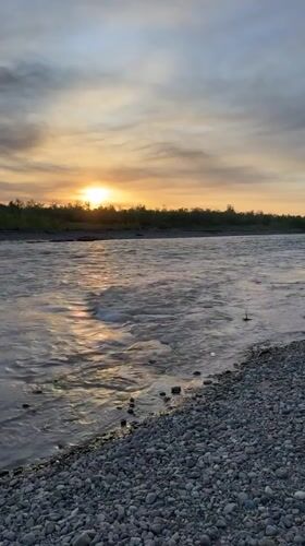 Sunset captured along river in Zarechny, Russia