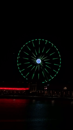 Colorful Ferris wheel light show captivates Lusail waterfront evening