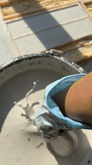 Person mixing, pouring plaster into decorative molds during crafting session