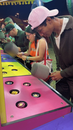 Young adults play arcade game in Thermal, California