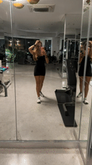 Woman takes mirror selfie at Pattaya gym