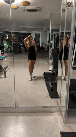 Woman takes mirror selfie at Pattaya gym