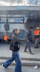 Workers maintain bus shelter in Zamaraevo, Russia