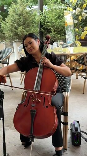 Outdoor cello, café table styling, and skincare products in Bishkek
