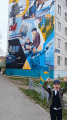 Children play at Tobolsk playground near historical mural