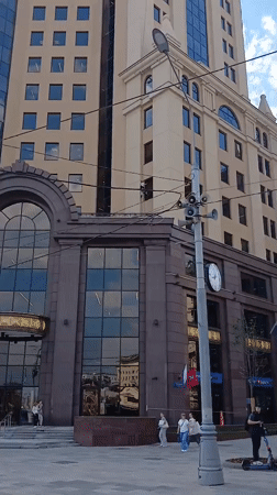 Mixed-architecture multi-story building exterior documented by witness