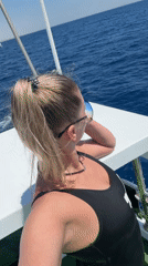 Woman relaxes on boat in Sharm El Sheikh waters