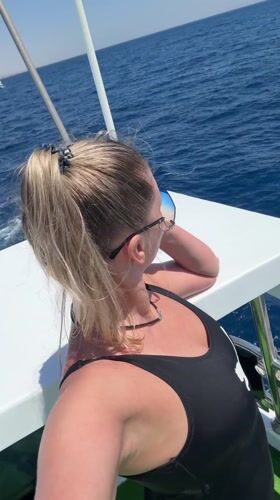 Woman relaxes on boat in Sharm El Sheikh waters