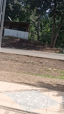 Rural Kenya road sees pedestrians, students, motorcycle traffic