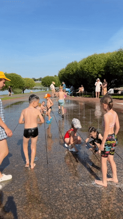Kids cool off at a Minsk splash pad on a summer afternoon
