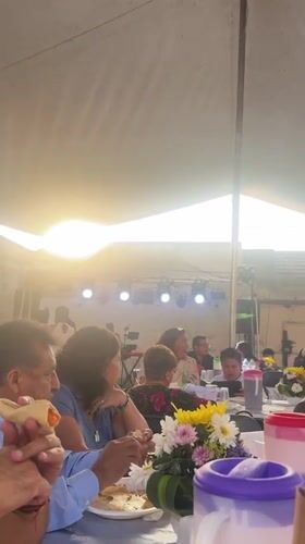 Community gathering held under tent in Puebla, Mexico