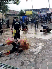 Traditional martial arts performance held in Indonesian village courtyard