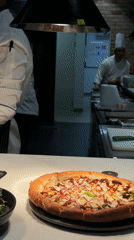 Dubai restaurant kitchen scene captured with chefs, prepared dishes